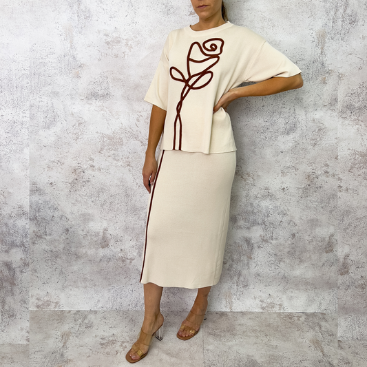 Set bordado y tejido beige.