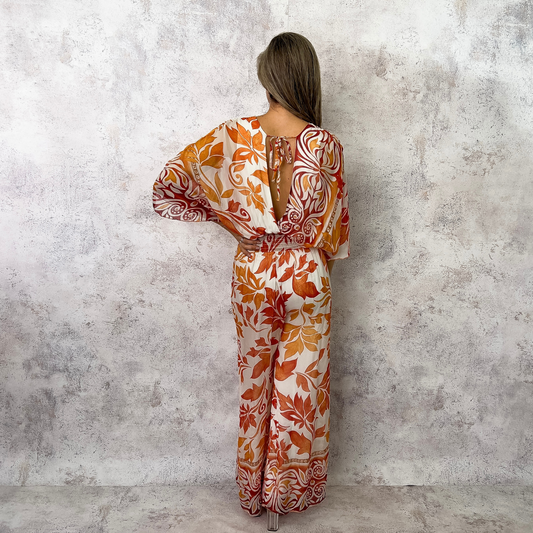 Jumpsuit seda hojas blanco/naranja.