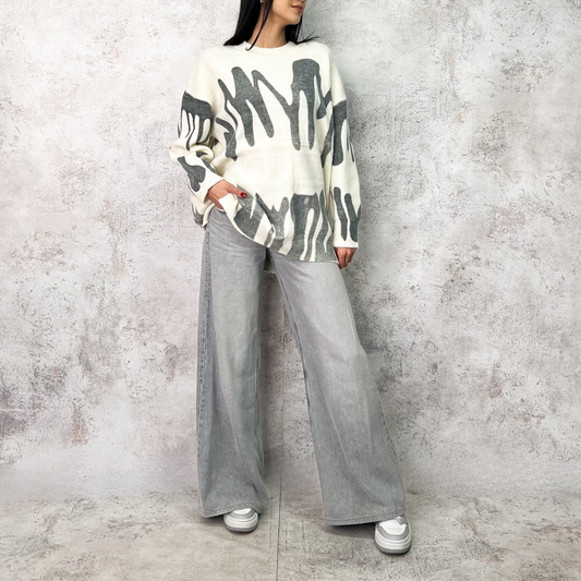 Suéter largo figuras gris