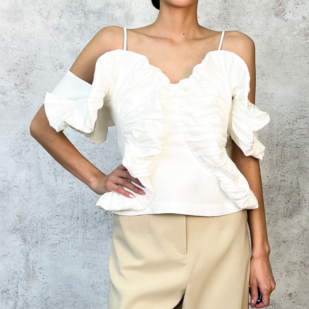 Blusa plisada blanca