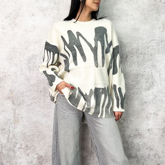 Suéter largo beige figuras gris