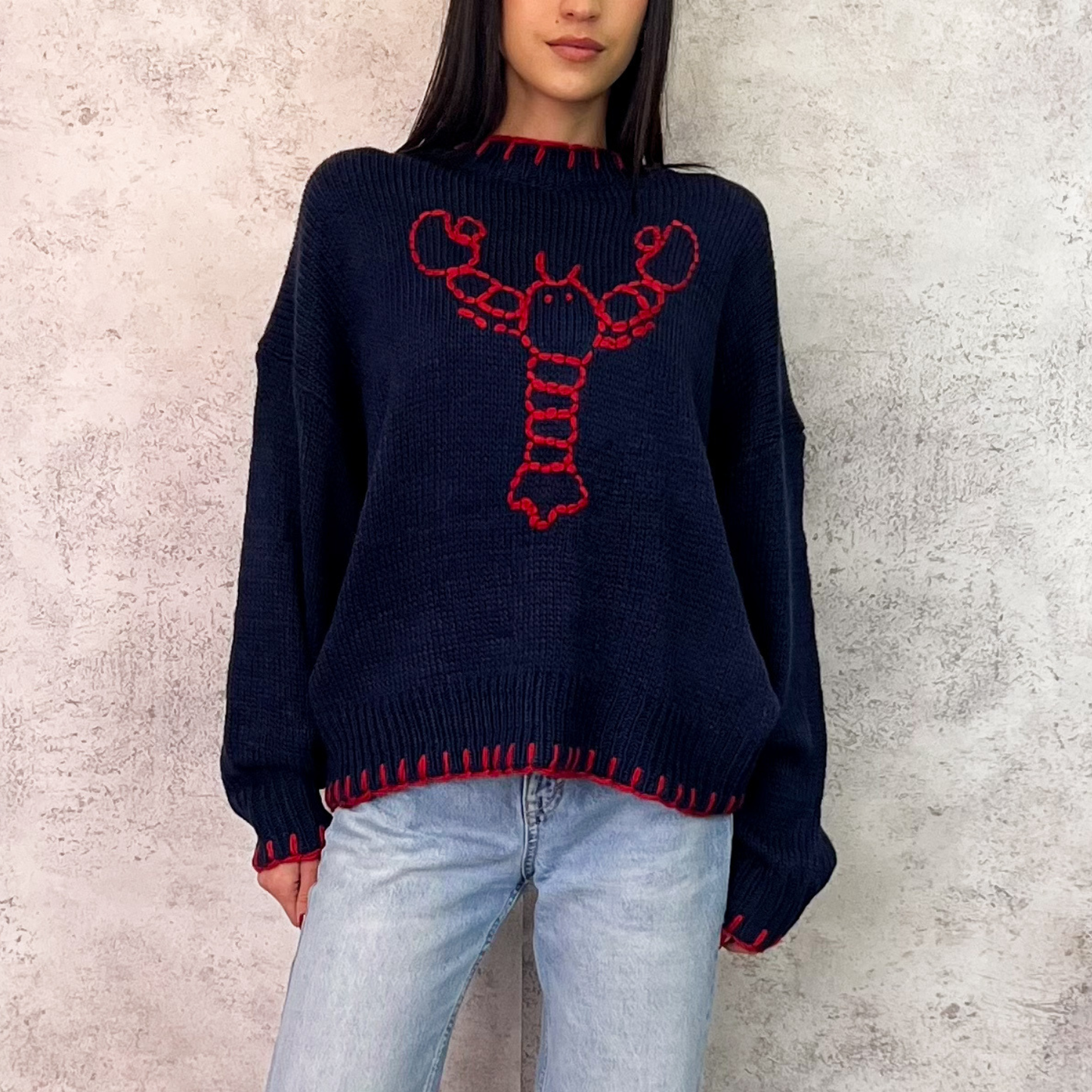 Suéter azul marino langosta roja